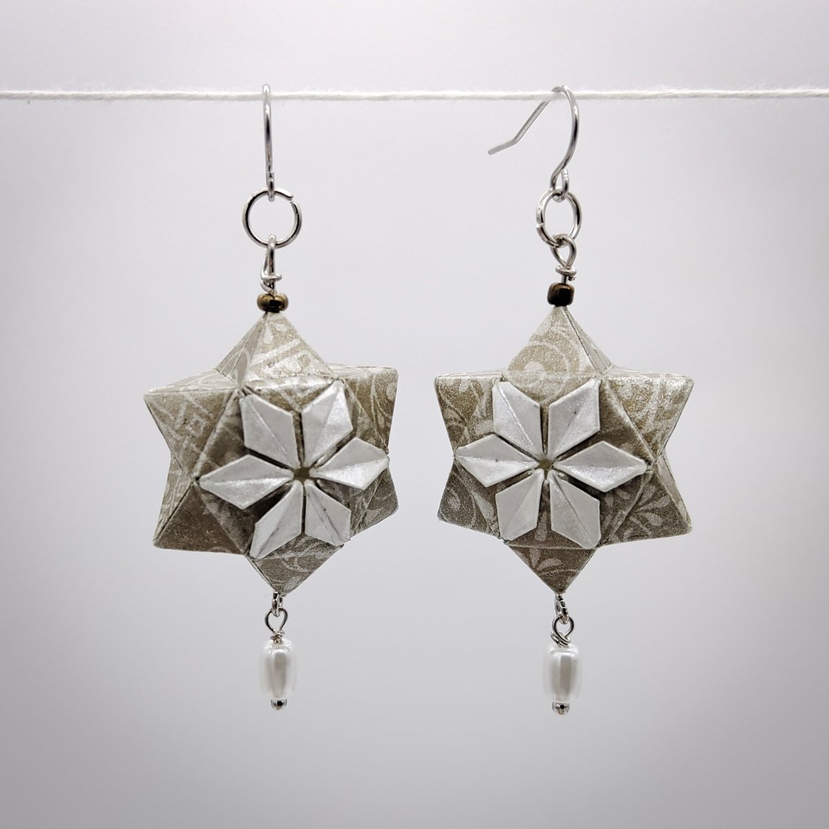 JesseGroch's tweet photo. @kmctcreative @ilpickle My partner and I started up a Handmade Origami Jewellery business recently. 
We've been getting a lot more support that we thought we would! 
https://t.co/zBem6vTI7Y https://t.co/C8O5VjAiZ3