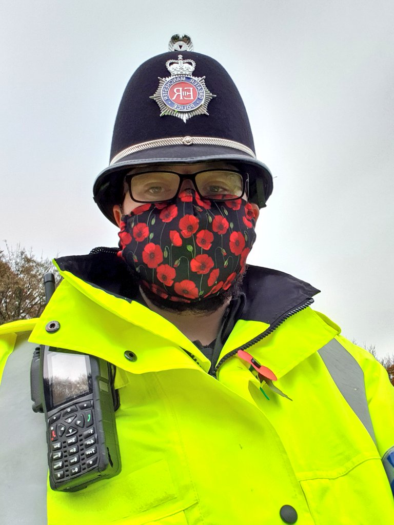 PC__Jones's tweet photo. Out this morning, paying respects and patrolling Milnrow. Many thanks to @Rach31M for the face mask. #RemembranceDay https://t.co/2jjacffSSs