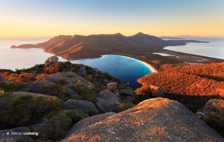Scrambling up Mt Amos for sunrise at Wineglass Bay in Tasmania⁠