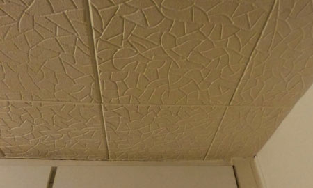 Number 12Polystyrene ceiling tiles.On a kitchen ceiling. Above the pressure cooker. Pure Final Destination.