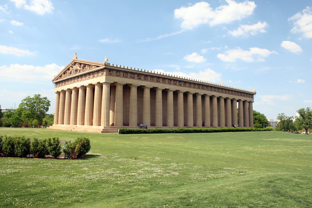 Unlike the marble Athenian Parthenon, The Nashville Parthenon is made from reinforced concrete and stands on a brick and stone foundation. However, the material from both monuments gives off a similar honey color.