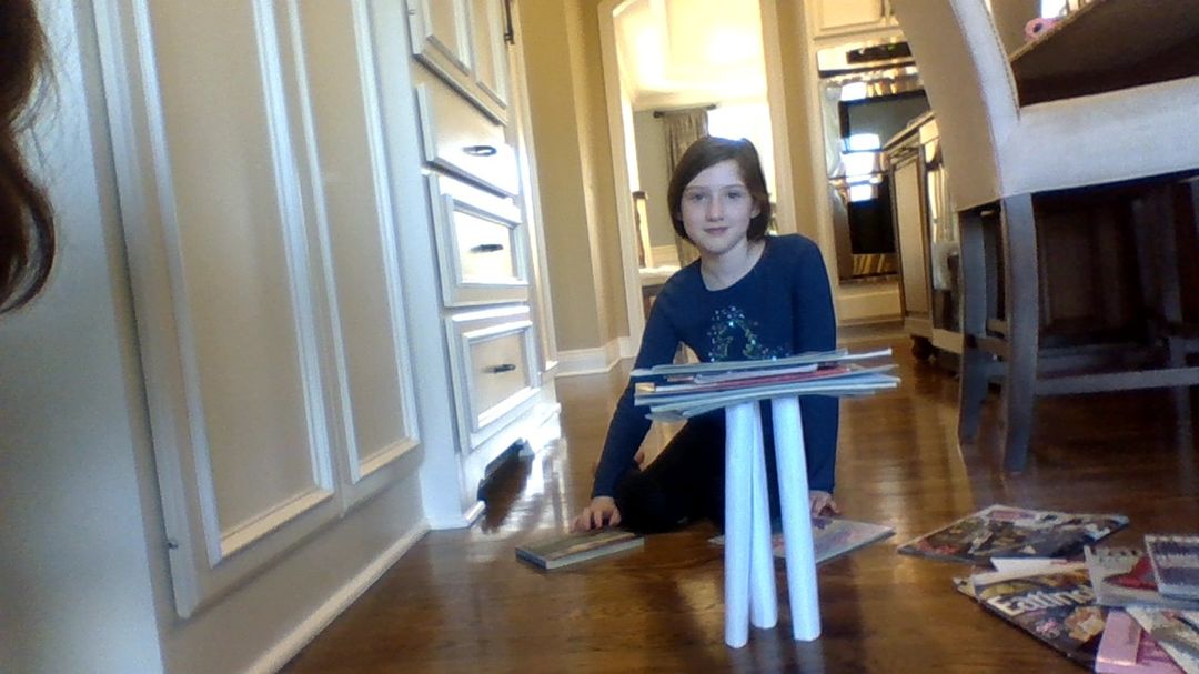 SherryMich's tweet photo. Our online second graders showed off their engineering skills by creating a tall and strong tower with only 4 pieces of paper. How many books could they hold? @MasonSchools https://t.co/ftX905f9nf