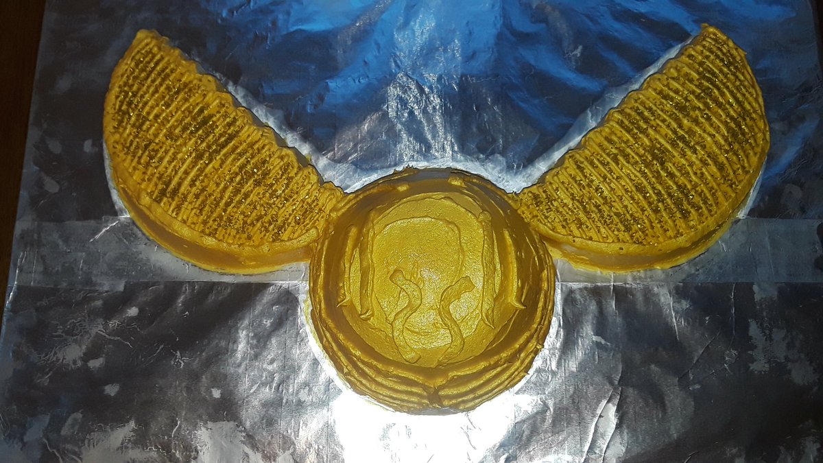 allergyheroes's tweet photo. Can you catch the #GoldenSnitch? Made of chocolate and vanilla #WackyCake with cream cheese frosting, gold sprinkles, & edible luster spray. (Never spray painted a cake before!) We had a few friends over last night for a #HarryPotter movie party for the kiddo's 12th #birthday. https://t.co/ps24mjmahj