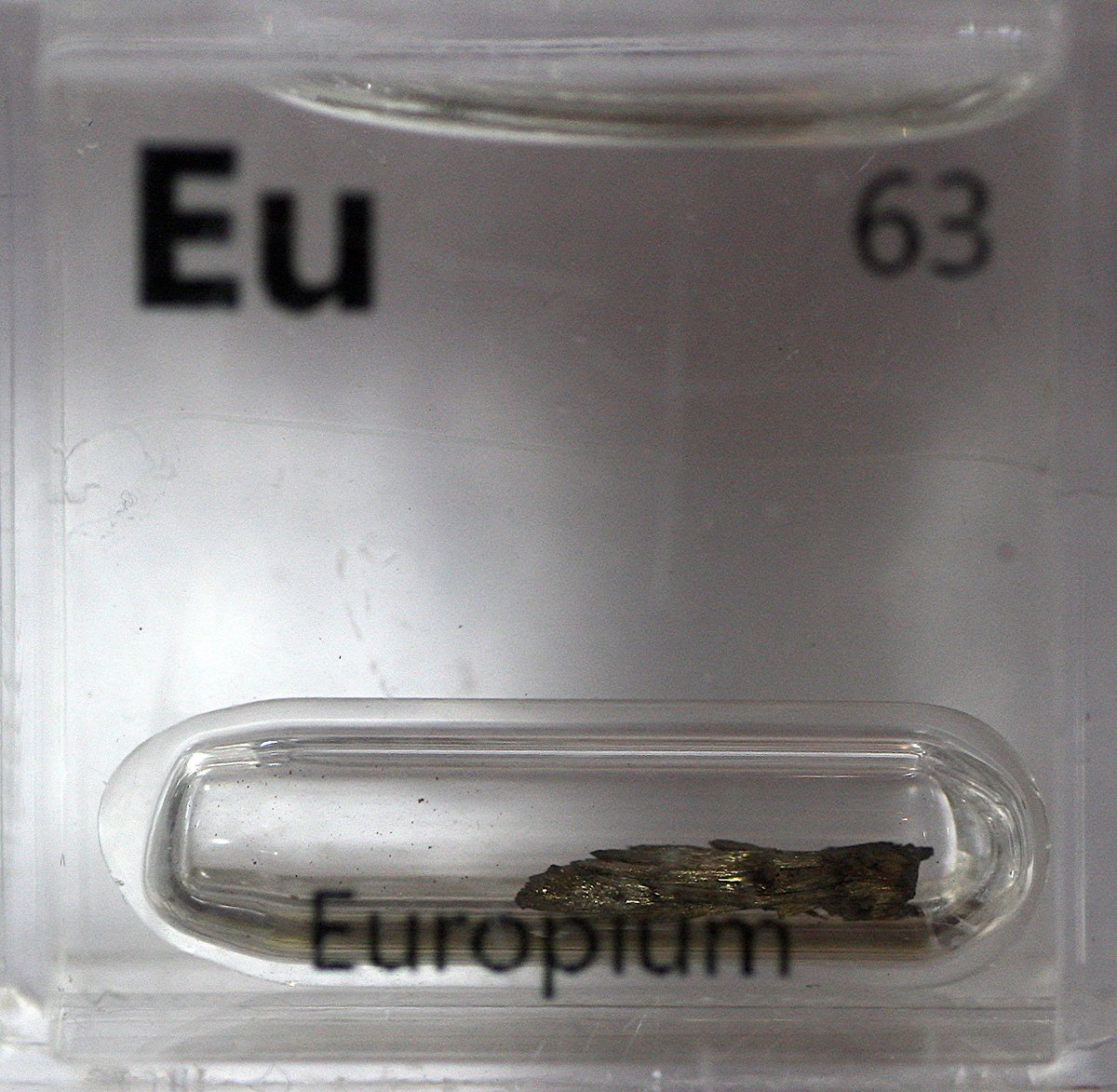 Europium  #elementphotos. White compound is europium oxide (Eu2O3), widely used in phosphors in TV sets. UV light induces a bright fluorescence, as seen here.