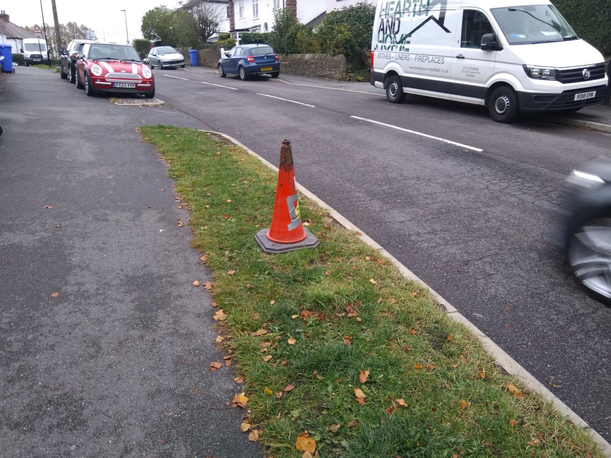 DavidWalsh_M's tweet photo. Just a moment to celebrate this superb #parking deterrent. Untouched for literally months on a verge near a #Sheffield school, amid traffic chaos. The key, it seems, is a large, heavy cone and a good coating of axle grease. #grassnotmud https://t.co/c3a8rEpn06