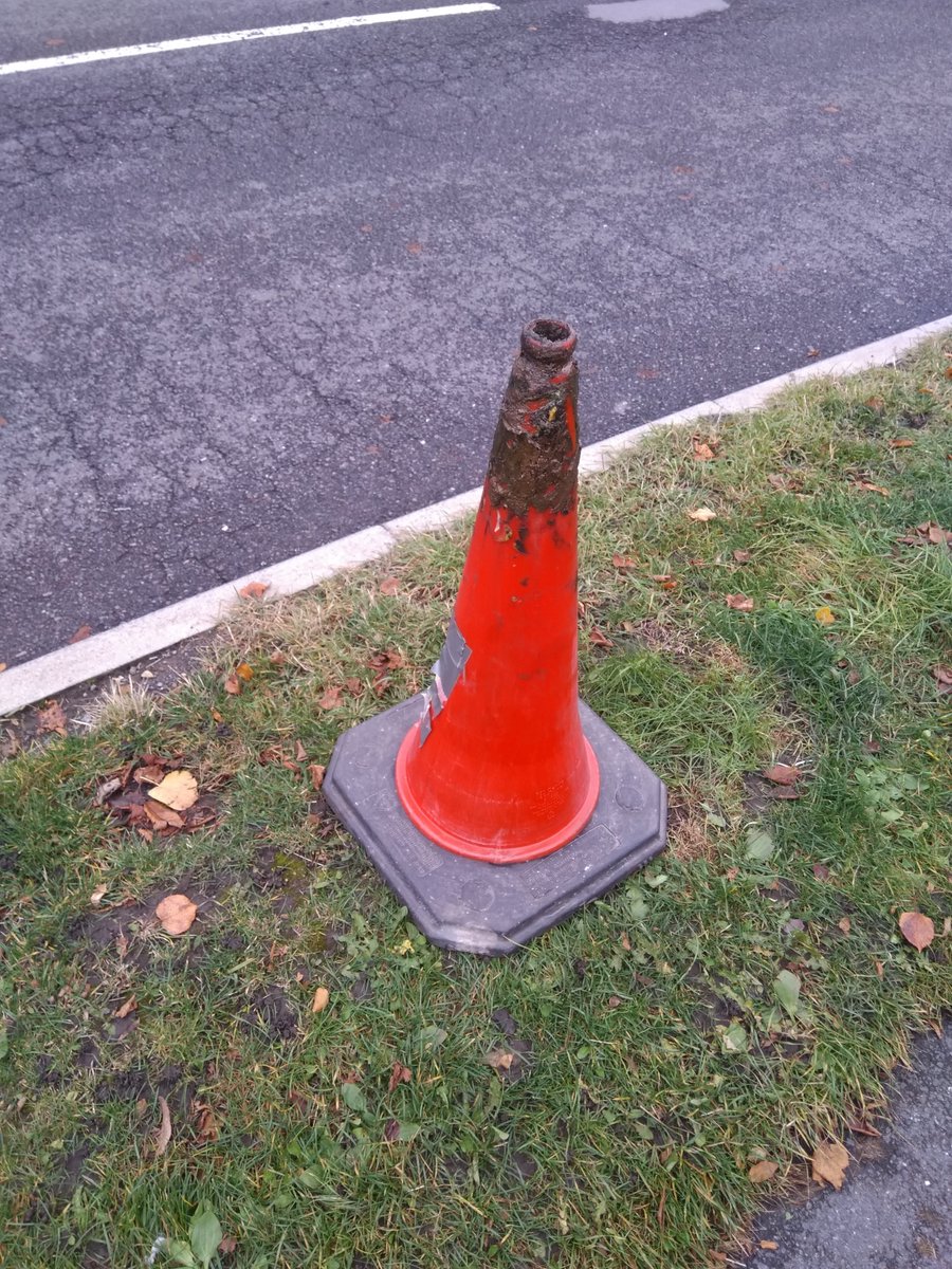 DavidWalsh_M's tweet photo. Just a moment to celebrate this superb #parking deterrent. Untouched for literally months on a verge near a #Sheffield school, amid traffic chaos. The key, it seems, is a large, heavy cone and a good coating of axle grease. #grassnotmud https://t.co/c3a8rEpn06