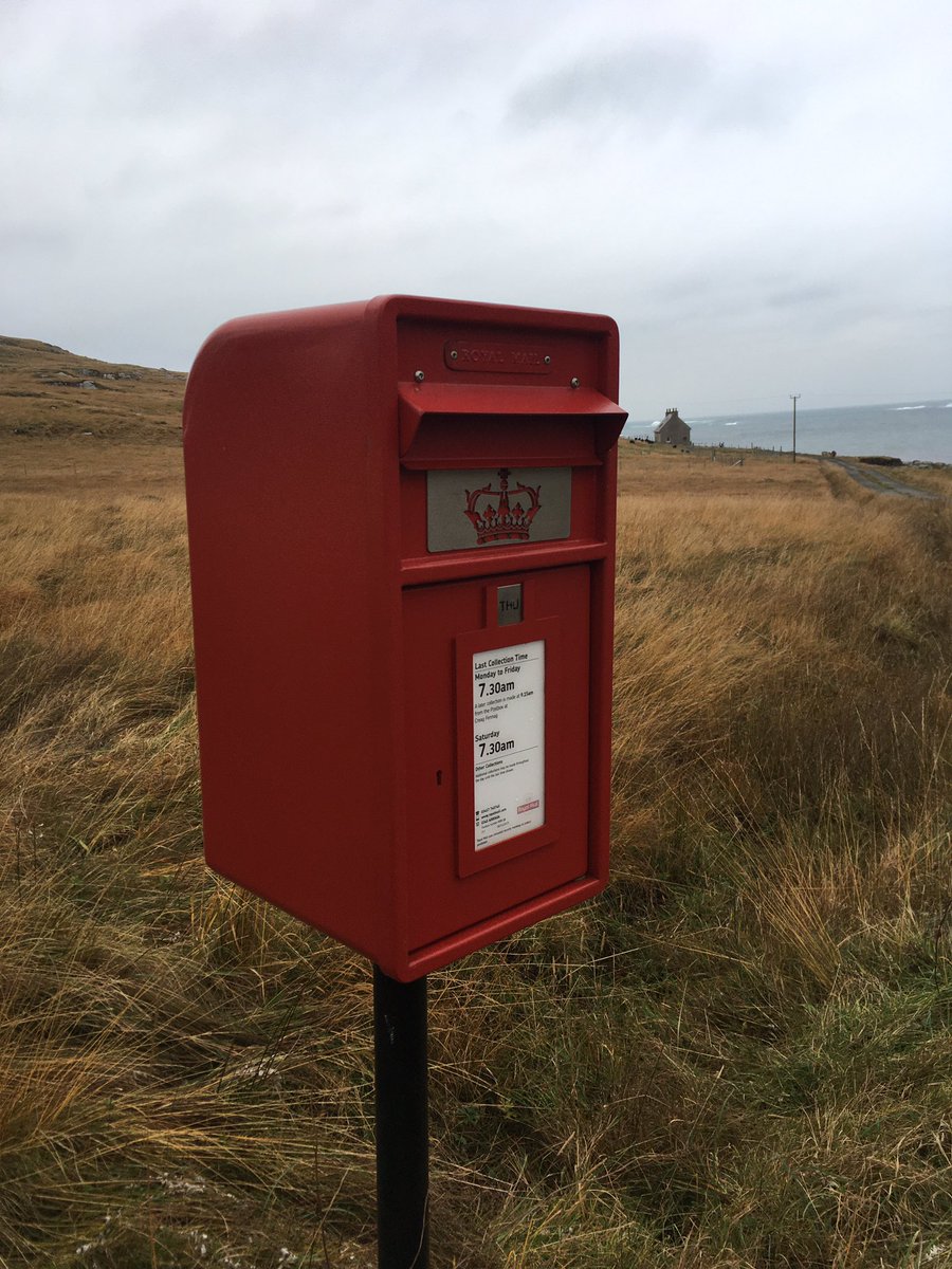 BarraIsland's tweet photo. Another #postbox portrait this time situated at Caolis turn on #Vatersay. Note the weather flap over the entrance to keep the mail dry. This postbox is next to a bus shelter @HITRANS_RTP @RoyalMail #letters #stayconnected https://t.co/jQODVFnHOh
