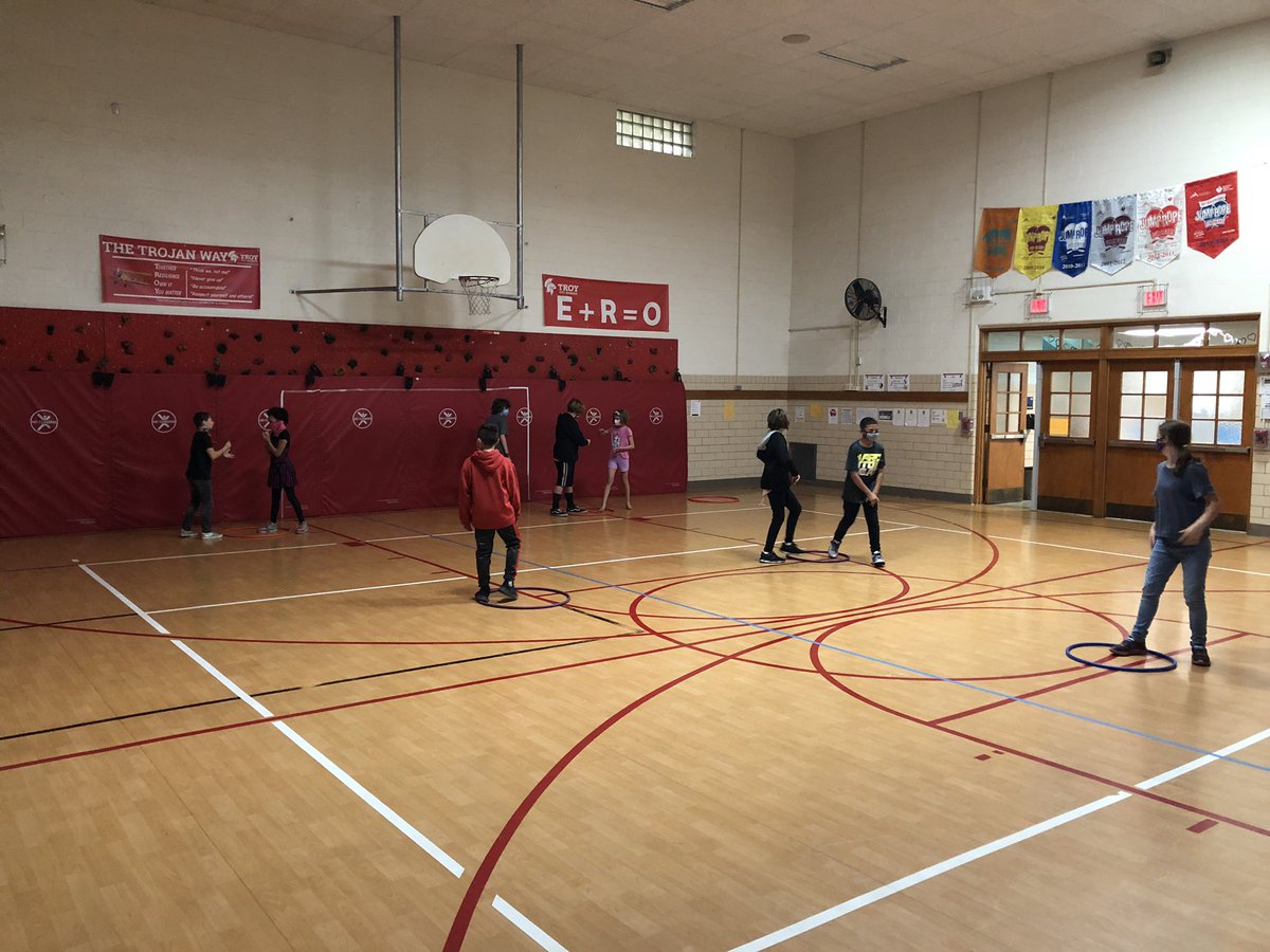 MrNawroth's tweet photo. Another type of a RPS battle in the gym...if you win in orange you go to purple, win in purple and go to blue, win in blue earn a point...if you lose, go back to orange and try again...who can get the most points? @Forest_TCS #TheTrojanWay https://t.co/x0Q0CPojni
