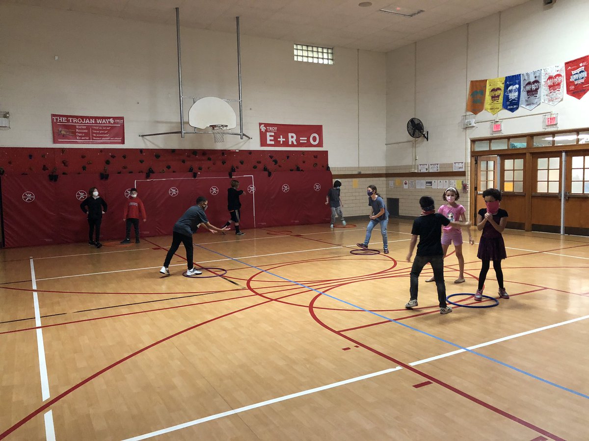 MrNawroth's tweet photo. Another type of a RPS battle in the gym...if you win in orange you go to purple, win in purple and go to blue, win in blue earn a point...if you lose, go back to orange and try again...who can get the most points? @Forest_TCS #TheTrojanWay https://t.co/x0Q0CPojni