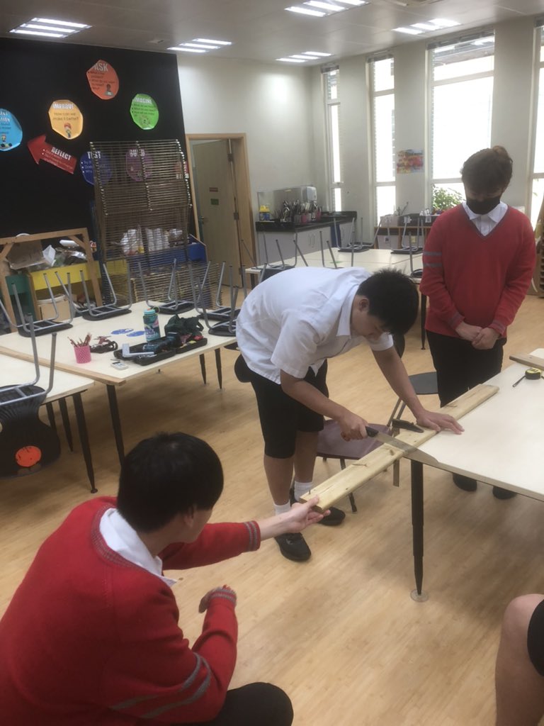 JoshLovestone's tweet photo. We finished our first day of building our raised garden bed so we have a place to grow our vegetables. Measure 📐 twice, cut once. #HandsOnLearning #InThisTogether  #gardening #mathisfun #tismacao https://t.co/U1RSUTASKQ