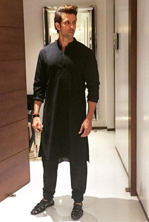  #Diwali lookbook - let  #HrithikRoshan guide you to picking the best outfit for the festival! A thread: 1. Keep it simple and classy by opting for a plain black kurta and a pathani salwar with sandals and a leather-strap watch!
