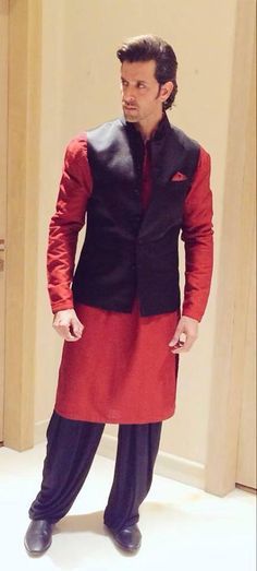 3. Wanna experiment with contrasts? Go for it! Get a red raw silk kurta, with a navy blue salwar and a sleeveless bandhgala jacket - don't forget the red pocket square!Go for mojari-style shoes to amp up the appeal! #HrithikRoshan