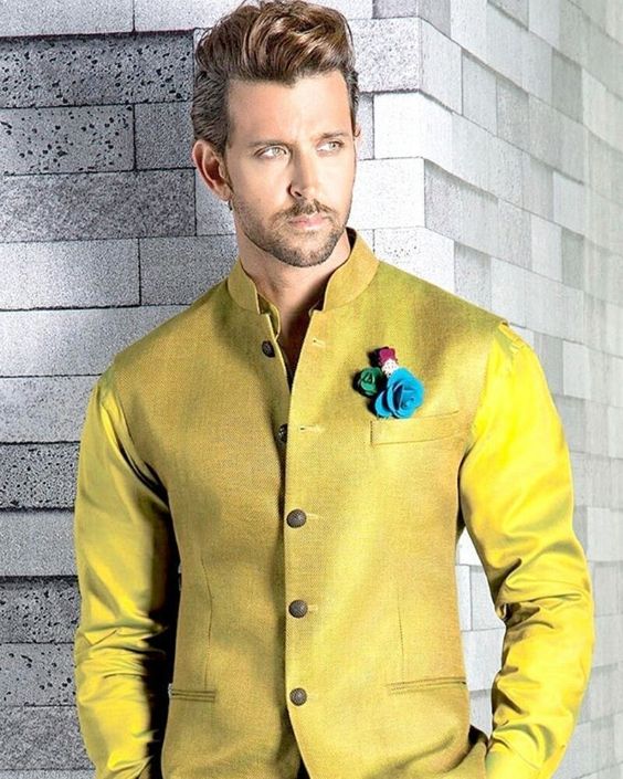 5. Fed up of blacks and whites and want something risque? We've got you covered! Play with fluorescent colours in silk and button up the bandhgala, fasten a multicolored brooch over the breast pocket!  #HrithikRoshan