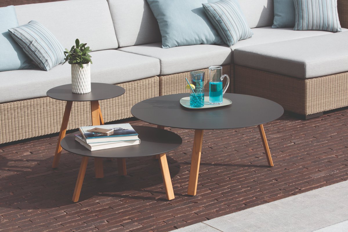 EasyFit Elite side table; natural teak legs and a choice of aluminum or Trespa tabletop finishes. Mix + match with any collection effortlessly. #interiordesign #outdoorfurniture #designerfurniture #sidetable #coffeetable #exteriordecor
