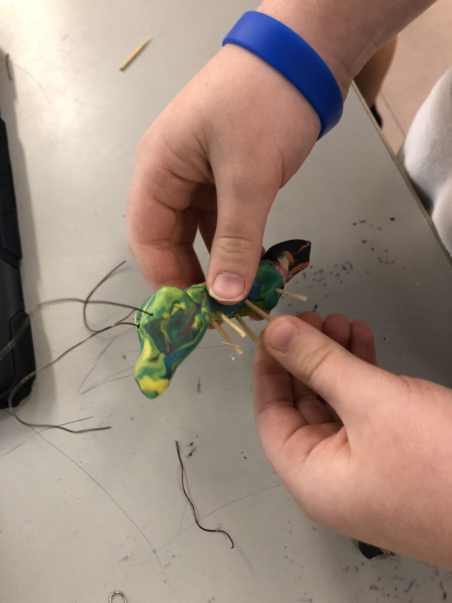 carney_dana's tweet photo. G4 mystery bags: each student receives an assortment of random recycled materials in their bag. How can you use #DesignThinking and the #creativecycle to create a toy or game? Such diverse #perspectives: an ant, a rocket launcher car, an ornament, a campfire and tent. https://t.co/1cxwW6I9sX
