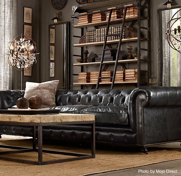 Jungkook chose a leather couch and a cozy rug to complement the industrial feel of his room. The leather couch is a prime element of the more masculine "man cave" industrial style. It's also a modern couch design, adding to the sleek look of the room. +