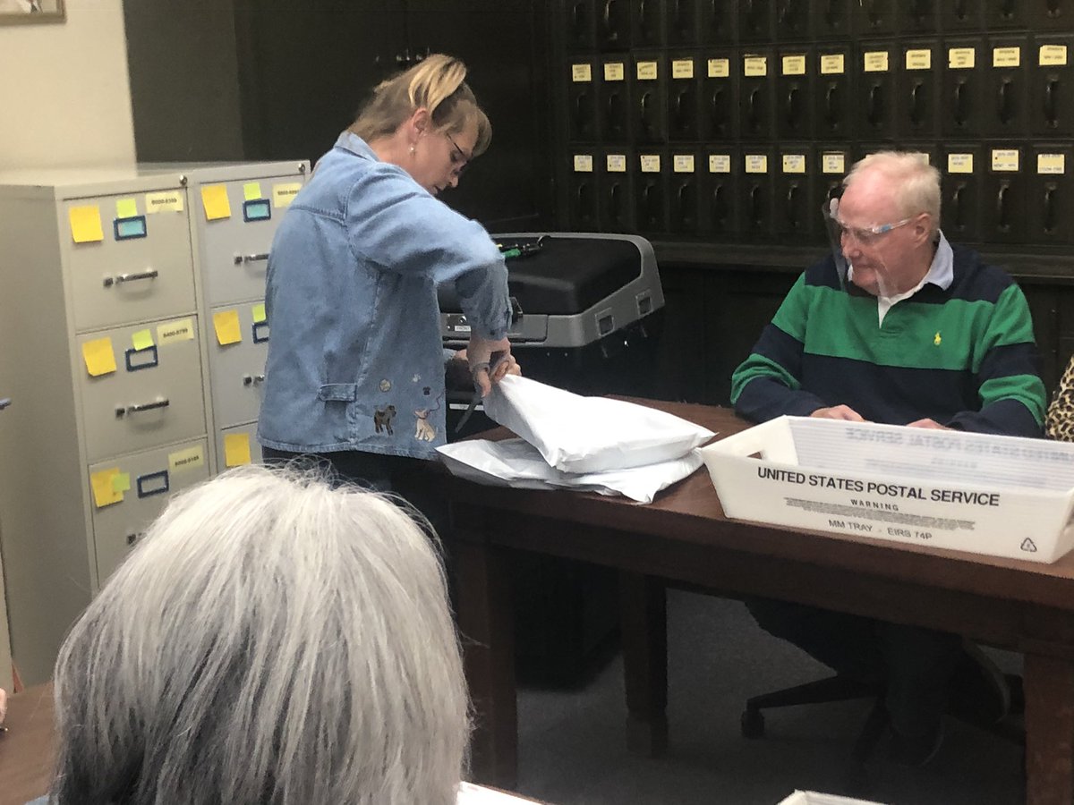 The opening of the Clear Creek Poweshiek counting machine. Ballots had been sealed inside plastic shrink wrap type bags and locked inside the machine since the recount of Saturday. Note the clippers used to cut open the metal seal.  #IA02  #iapolitics