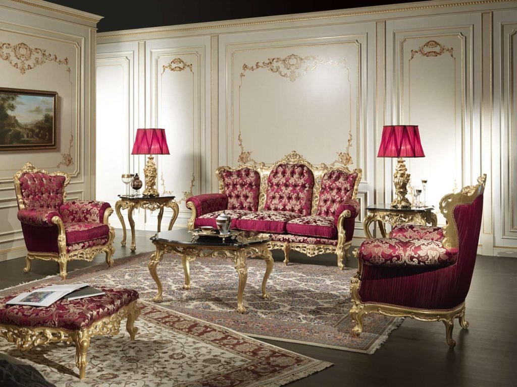 The couch Jimin is sitting on and side tables are modernized baroque, with floral ornaments, beautifully complemented by the real flowers surrounding him. The padding pattern on the couch, and its winged shape, are also typical of the baroque style (Versailles on the right). +