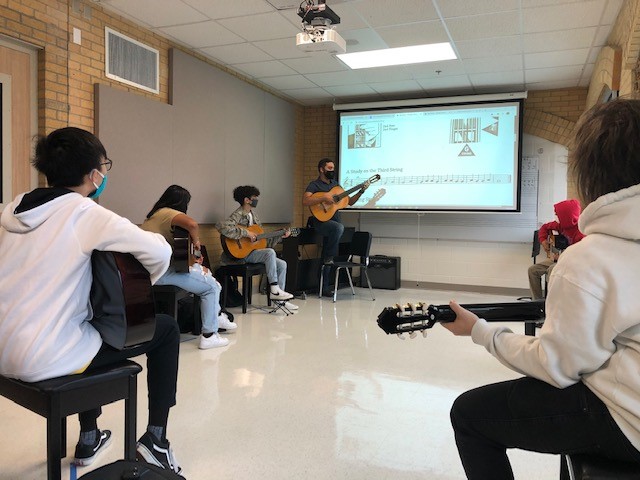 GHS_Owls's tweet photo. Our teacher spotlight this week shines on Mr. Jesse Ramirez. Teaching guitar has been difficult in virtual learning, but he has made it work by using Studio videos in @CanvasLMS to model to his students and give feedback. Thanks, Mr. Ramirez! #ChoosetheOriginal https://t.co/049RNxPanv