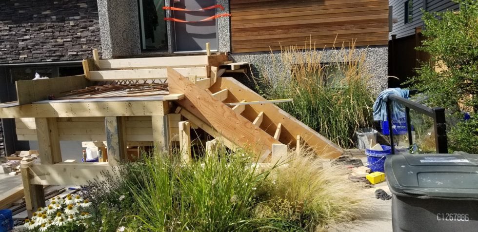 DiversifiedCon's tweet photo. When wood steps turn into concrete steps! 

The massive 2′ thick structural wall was built first to hold the cantilevered concrete steps to be poured later. Piles and footings were poured monolithically at the same time with rebar connecting those elements.
 #yyc #dcs https://t.co/amGRGN6wvA