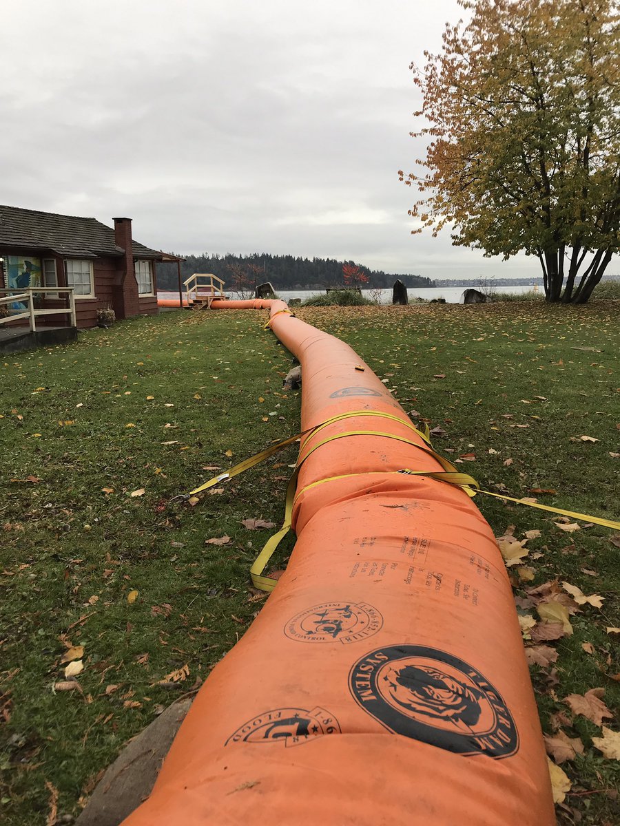 HJMrdck's tweet photo. With a king tide, wind storm, and rain forecasted we’re likely in for a wet one tomorrow. Mobile barriers with accessible ramps were already set up in West Vancouver this morning #BCStorm #FloodRisk https://t.co/zmADxi7hk1