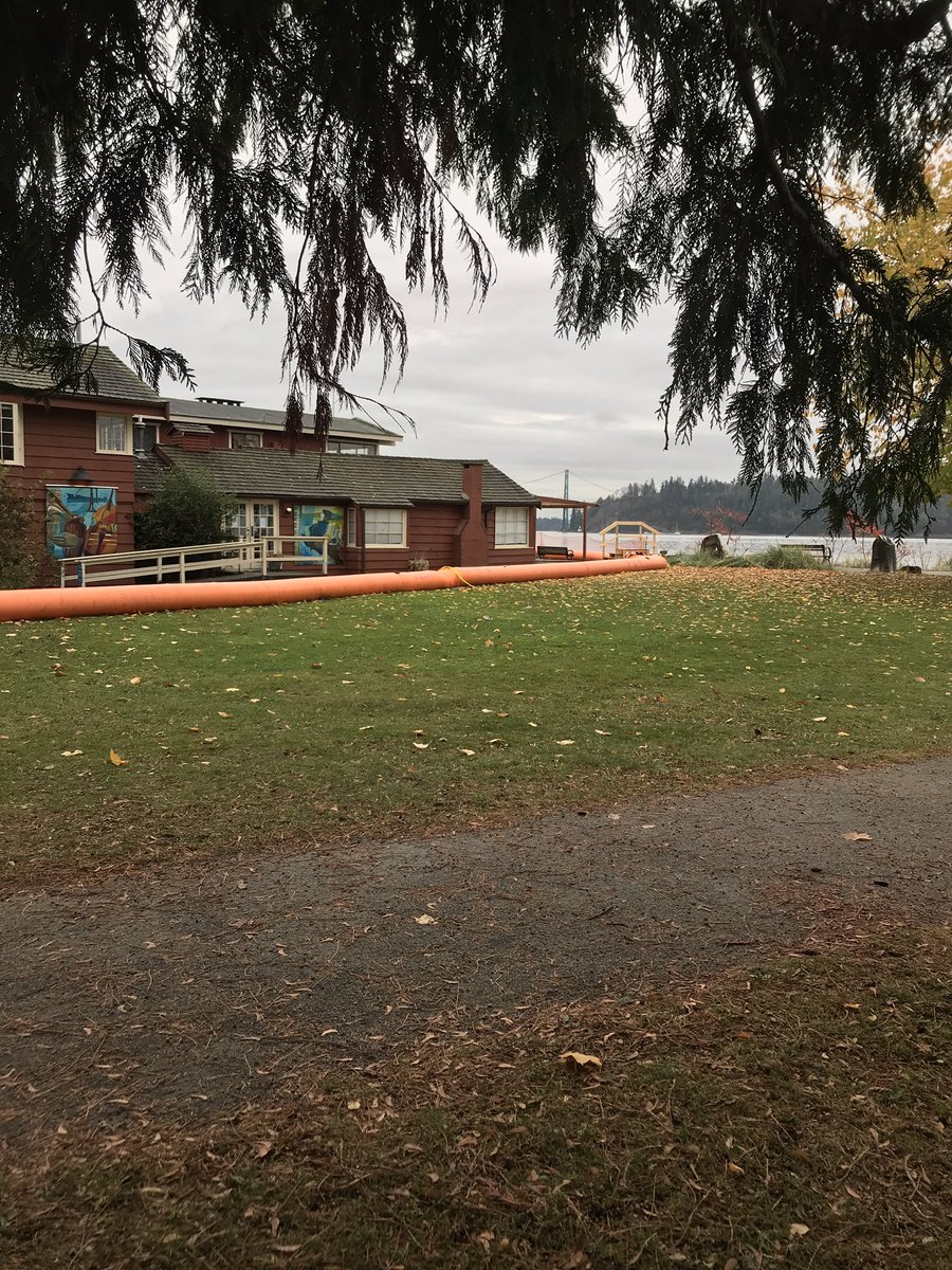 HJMrdck's tweet photo. With a king tide, wind storm, and rain forecasted we’re likely in for a wet one tomorrow. Mobile barriers with accessible ramps were already set up in West Vancouver this morning #BCStorm #FloodRisk https://t.co/zmADxi7hk1