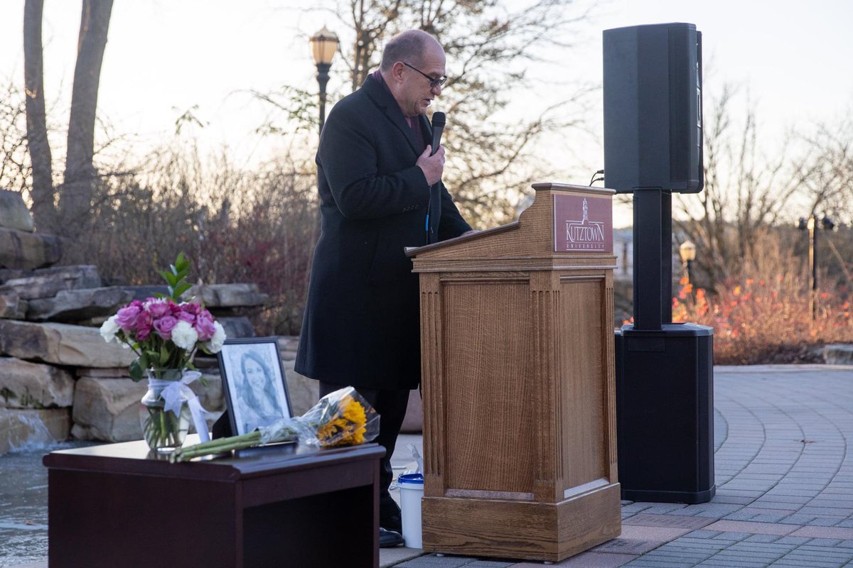 President Hawkinson speaking at podium.