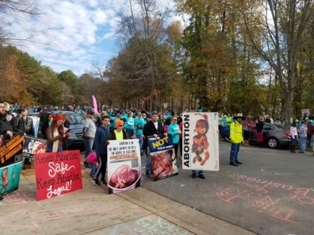 CLT4Choice's tweet photo. 2015 was the first 40 Week parade by @lovelifeclt outside of our clinic. They didn't have a permit that year either. They literally took over the street on front of the clinic. #NotCounseling #40WeeksOfHarassment #harassmentNOThelp https://t.co/3y5i6olQhn