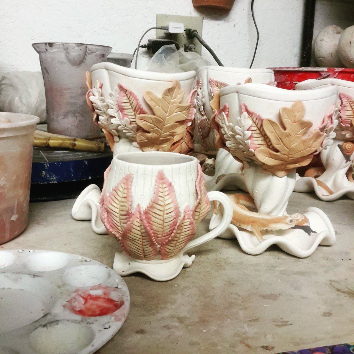 StasevichStudio's tweet photo. Leaves are kind of a lot of fun to paint. I'm starting out with the cherry leaves, and they're already going to be yellow, but without a little more attention they'll just be a pretty flat yellow. #sculpturalceramics #functionalsculpture #teacup #chalice #autumnleaves https://t.co/uUSAqloGtq