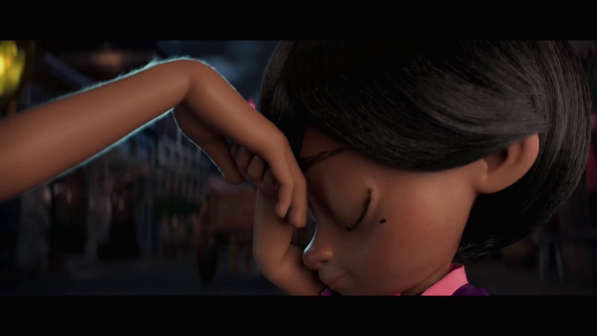 This gesture is the Mano or Pagmamano, and is made as a sign of respect to our elders. It's often accompanied with a verbal 'mano-po' and is usually done when entering a home or seeing an elder for the first time that day