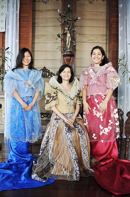 At one point the grandmother has a scarf draped around her shoulders, which is reminiscent of a panuelo, a kind of kerchief that is part of the traditional Maria Clara or Filipiniana gown ensemble