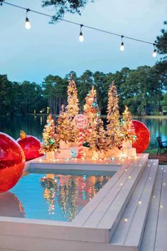 Golden hour, hubby in a Santa suit, and our pool deck is DECKED out! Get all the details on our outdoor holiday decor! #sugarandcloth #christmasdecor #holidaydecor #santa #outdoordecor #outdoorholidaydecor #pooldecor #christmas