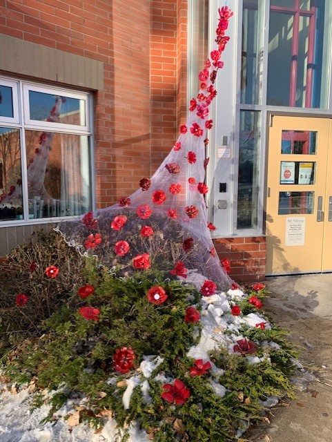 stdominic_ccsd's tweet photo. Poppy Fine Art Installation in Place. The poppies are draped cascading down from our school cross.  Nice work, Grade 3s and 4s! #WeWillRememberThem @CCSD_edu @Holly_FA @techmoberko #fineart @PamRath https://t.co/huDHYvBX0O
