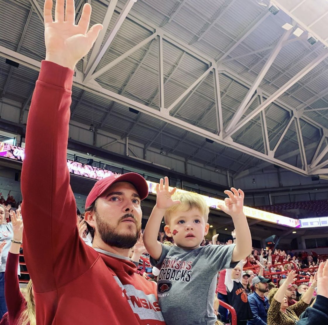 AnnMomographer's tweet photo. The girls like when the @RazorbackSpirit presents the Arkansas Flag with their rotating pyramid. But little Brother loves to watch @BigRed_UA run out on the field/court during the intro, carrying that big slobbering hog flag! I, LOVE watching my family do the Hog Call! https://t.co/nXhy2cURwC