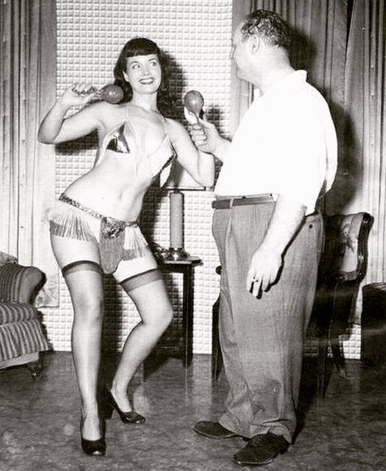 2 pic. 🥳 A regal serenade for the Pinup King! 🎶👑 Trailblazing fetish & glamour photographer Irving Klaw