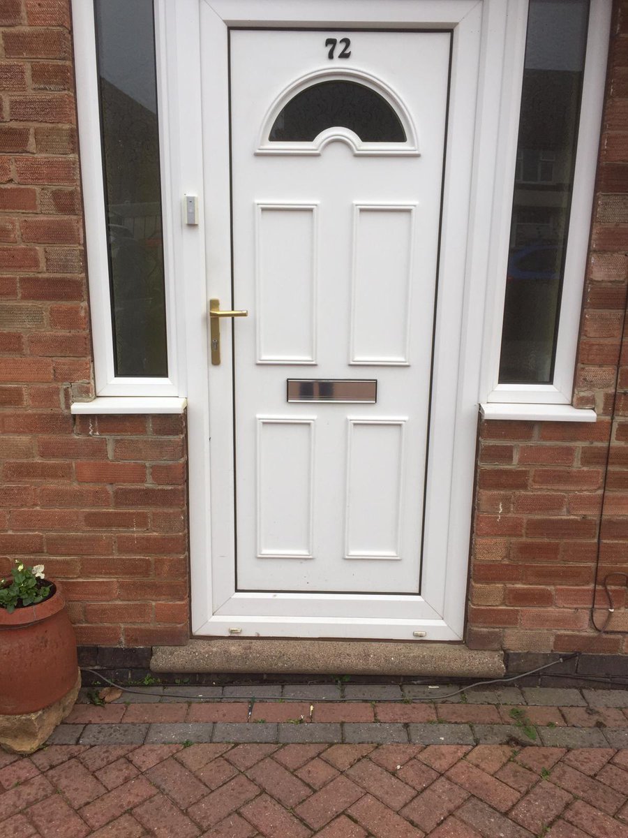 Before and after pictures of a brick cut with new composite door and side panels