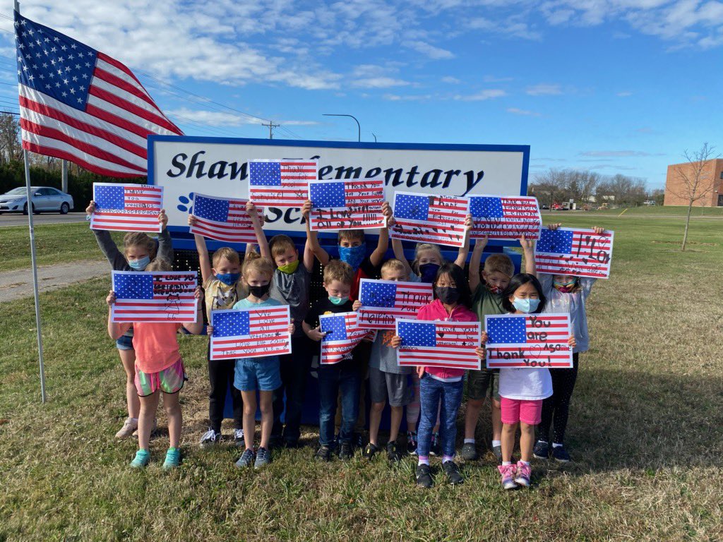 Students making signs to celebrate our military for our Veterans parade tomorrow at 9:00am