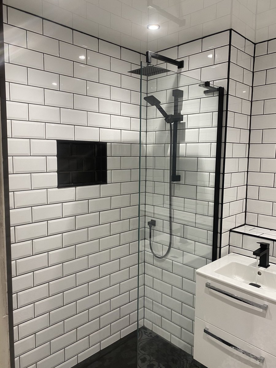OasisTiling's tweet photo. Sneak Preview for Twitter before FB. Happy to showcase our latest transformation of what was a dank and dated old bathroom. The black fixtures, grout and trims really make this one a standout! What do we think? https://t.co/uLZ1k7Vlr6