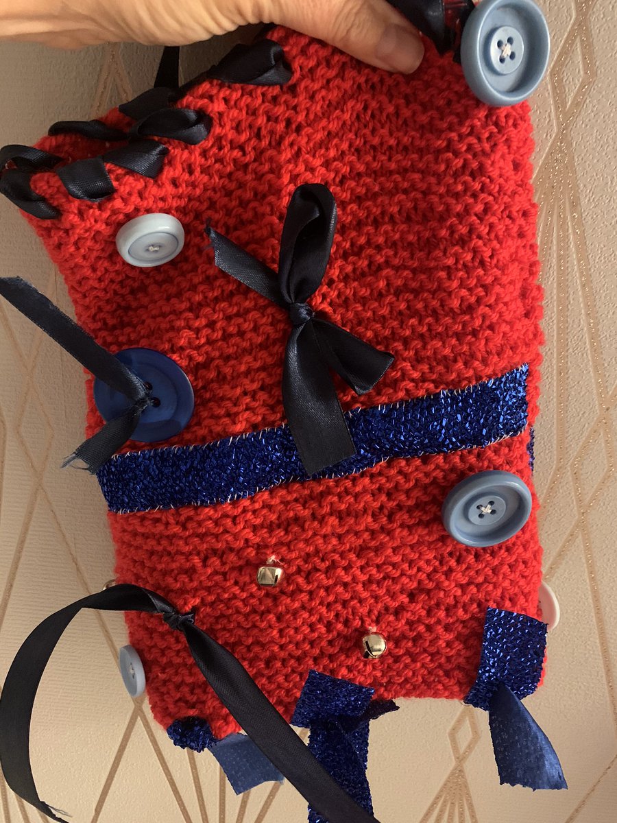 TrishQuenby's tweet photo. First Fiddle Muff finished. It’s not pretty but hopefully it will do its job and help somebody with dementia during their stay with us on @ClarendonWard @patsy_huband @GeetaChauhan16 @CHSInpatientLPT #notaknitter #triedmybest #fiddlemuff #dementia https://t.co/v6xFjaYyyO