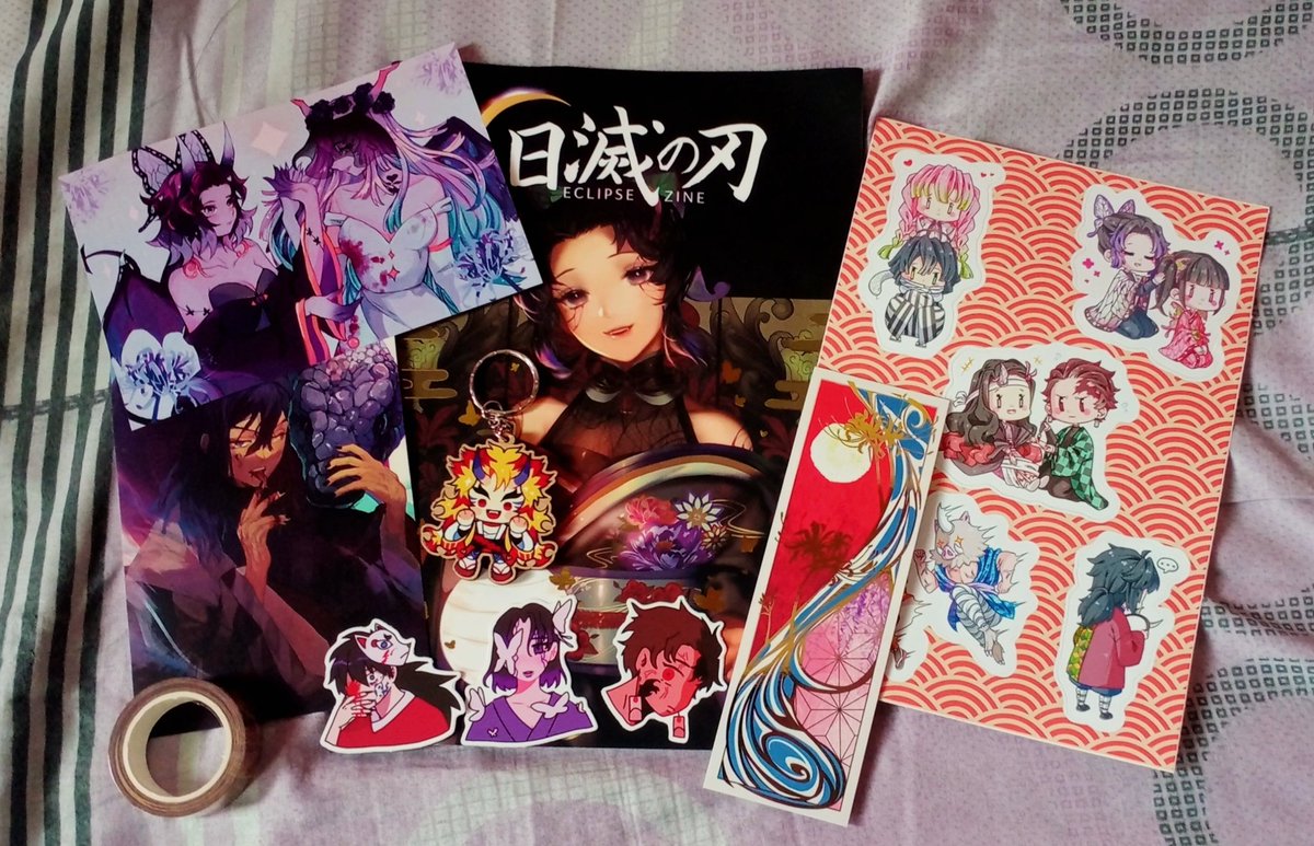 masterhandss's tweet photo. Finally got my copy of the @KimetsuZine !! Everything is so beautiful and high quality I loveee 🦋🦋🦋💕 https://t.co/HfjFWQKVaI