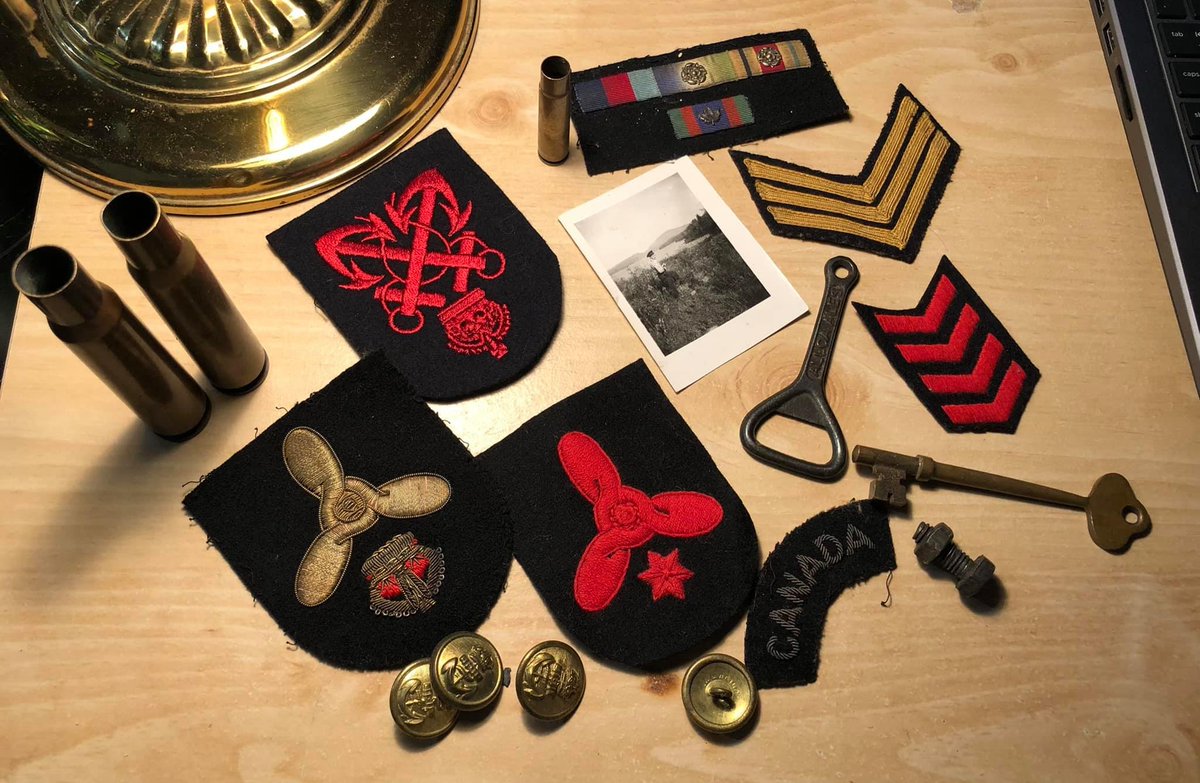 There's some great stuff in the bag. Some pieces of uniforms, a bottle opener from a Scottish beer company, some shells, a key for something...