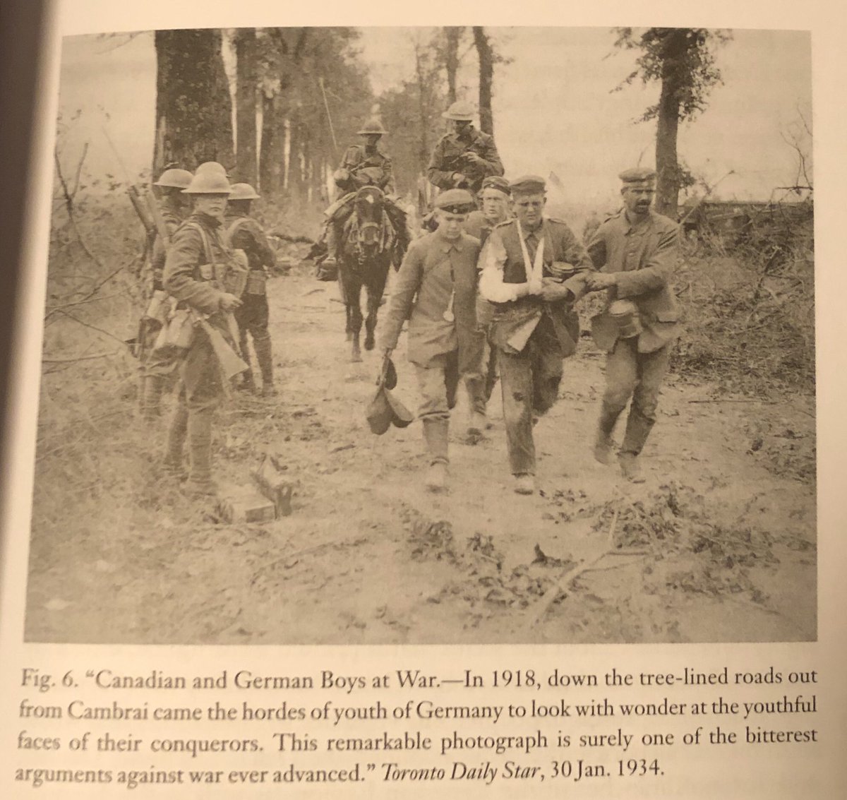 Letters to the editors hammered this point, as veterans and their families lambasted the war and the class system it upheld. This was highlighted by a series of war photos published in 1934. Some pictured here. Next tweet is a caption of a photo of Cdn soldiers w/one German. (24)