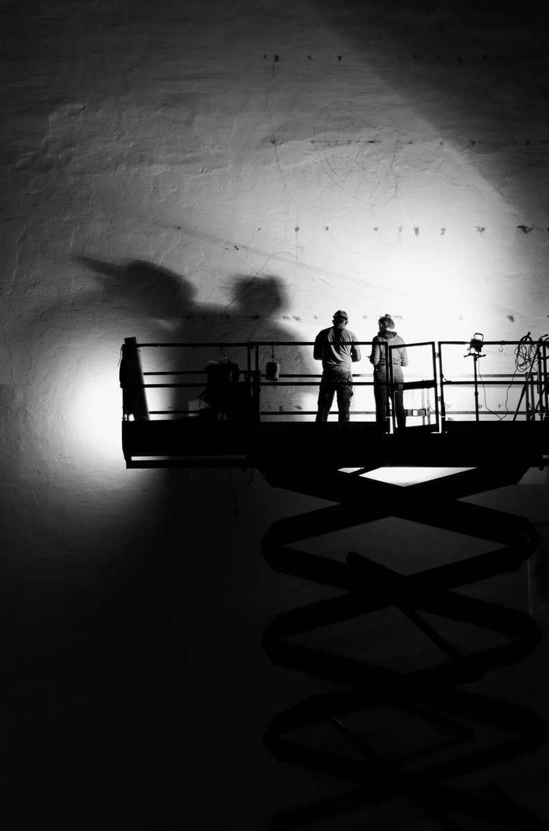 If you look just above their heads, you can start to see the outline of the late Congressman John Lewis