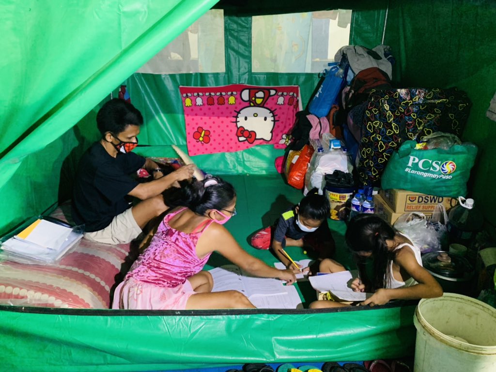 biancadava's tweet photo. LOOK: Children continue their learning even as they have evacuated to temporary shelters in their barangay. @ABSCBNNews https://t.co/3ktYPglqeq