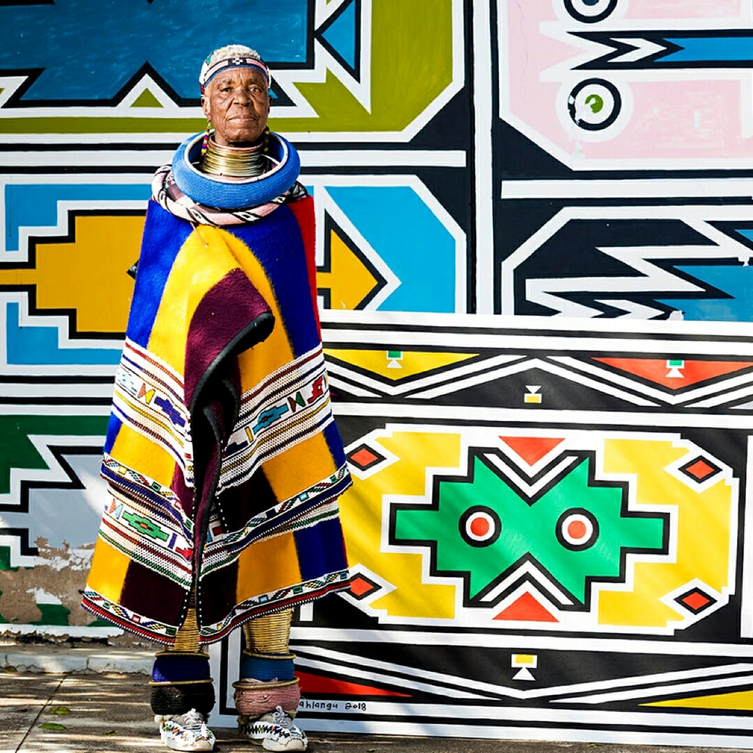 southafricauk's tweet photo. Today 🇿🇦 celebrate Dr. Esther Mahlangu’s 85th birthday. Best known for her colourful #Ndebele artwork, she has travelled the world sharing the story of South Africa's people, heritage and culture. Join her latest exhibition 👇https://t.co/p7ATZn9SKW #meetsouthafricaLATER https://t.co/A5nUDWEfga