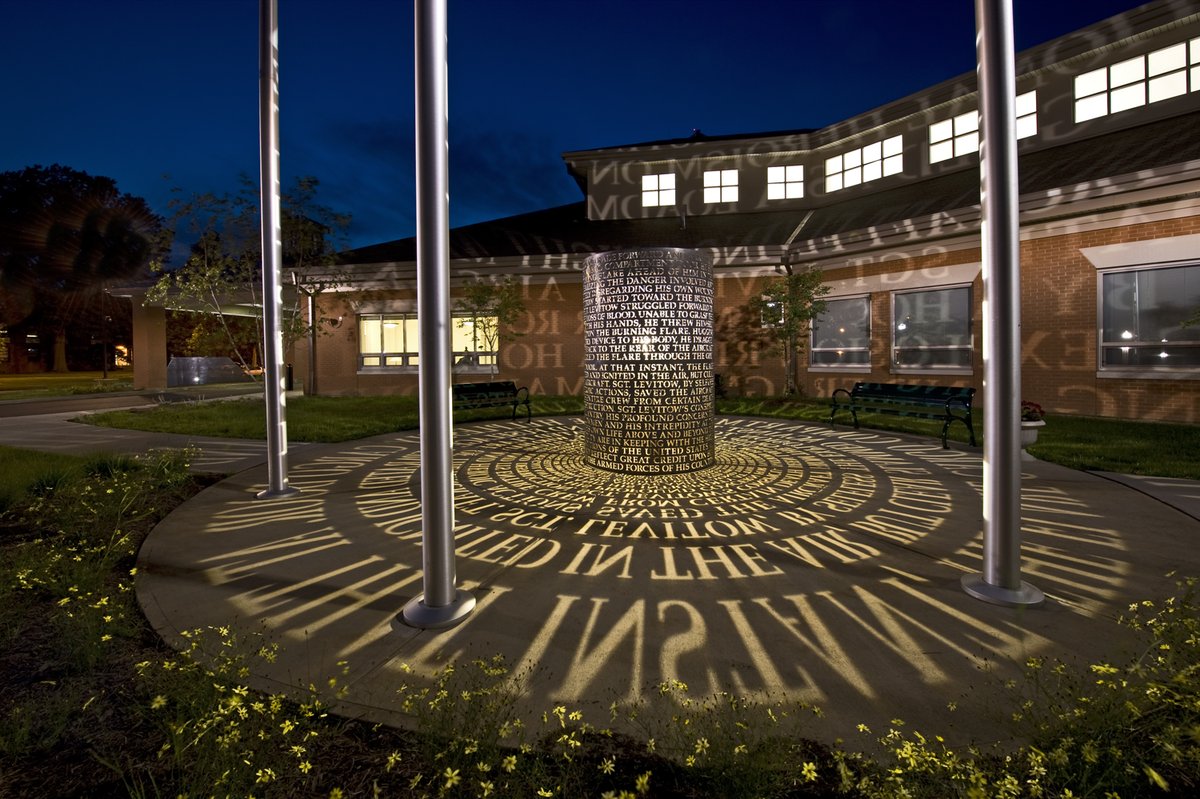 MPNarchitects's tweet photo. This Veterans Day, we honor our veterans and send our heartfelt gratitude to those who have served and sacrificed.  In the Memorial Garden at the Sgt John L. Levitow Veterans Healthcare Center, wording from Sgt Levitow’s Congressional Medal of Honor citation fills the courtyard. https://t.co/MtzO8LLM7i