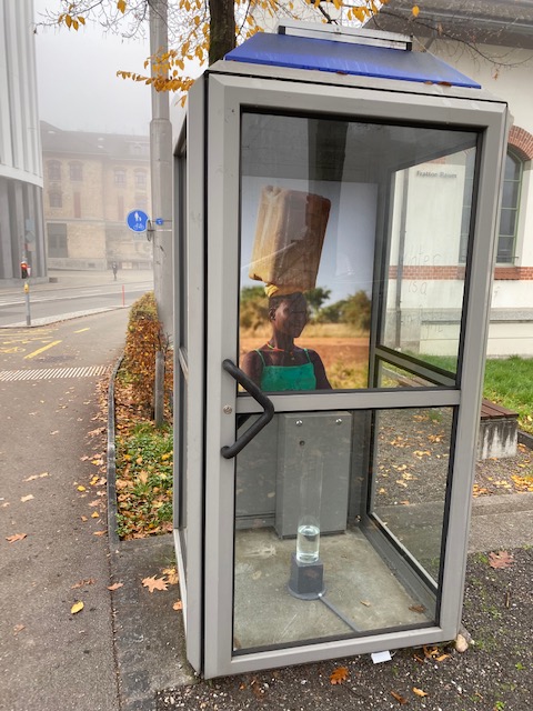 A wee exhibition in an old telephone box in St. Gallen, Switzerland with Rahel Flückiger - raising awareness on the human right to water - accompanied by reflections on the responsibilities of a young women carrying water in Aweil, South Sudan in 2014. ask-for-water.ch/?p=293
