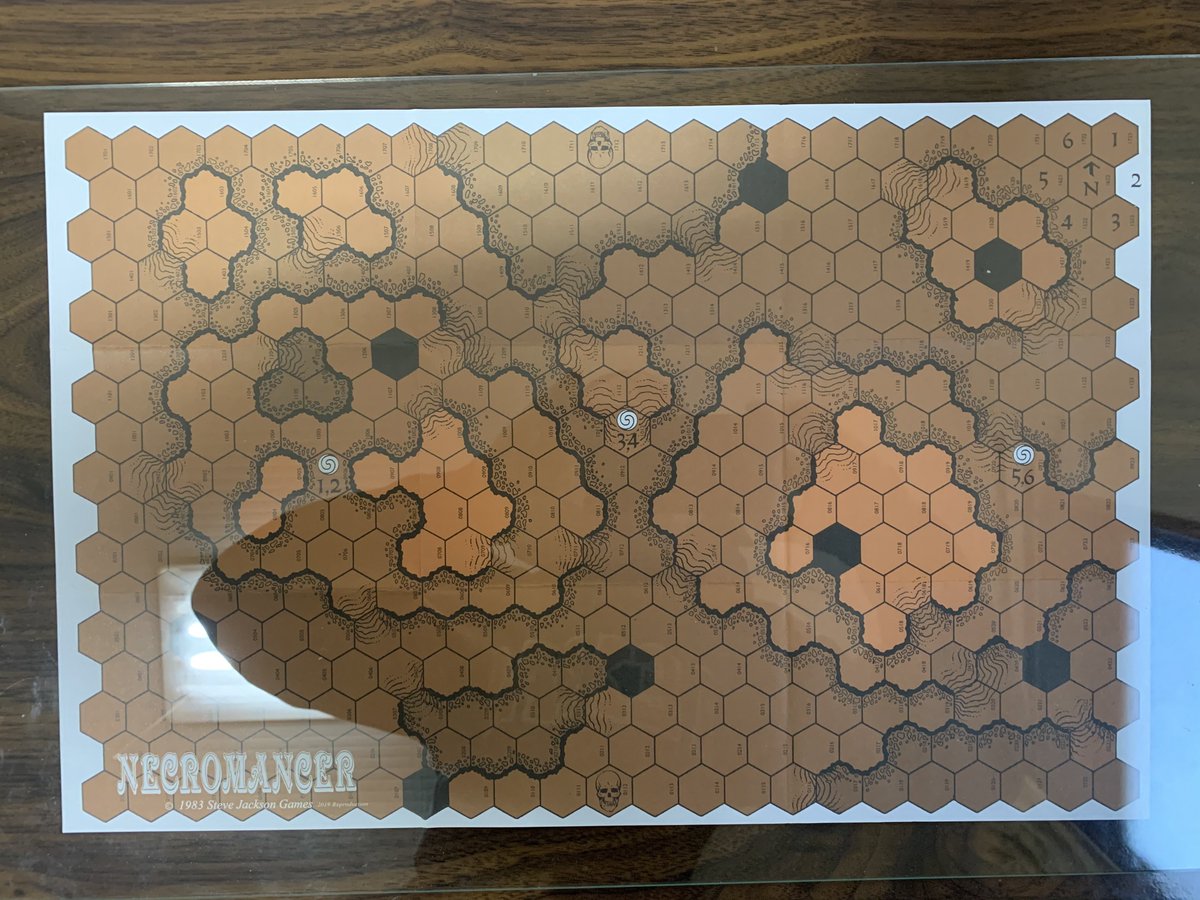 The Necromancer map (under a sheet of plexiglass)Lighter color is higher elevation. Black is treated as craters in Ogre, impassible. See scenario for how to handle ridge lines.