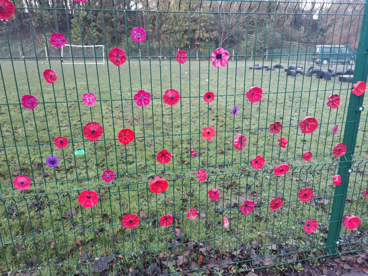 Spetisburyprim1's tweet photo. The school fell silent at 11 o'clock at the end of our Remembrance assembly. At the going down of the sun and in the morning we will remember them. Thank you all for your poppies along our fence that have helped us remember #lessweforget #remembrance https://t.co/bJORwi2lMs