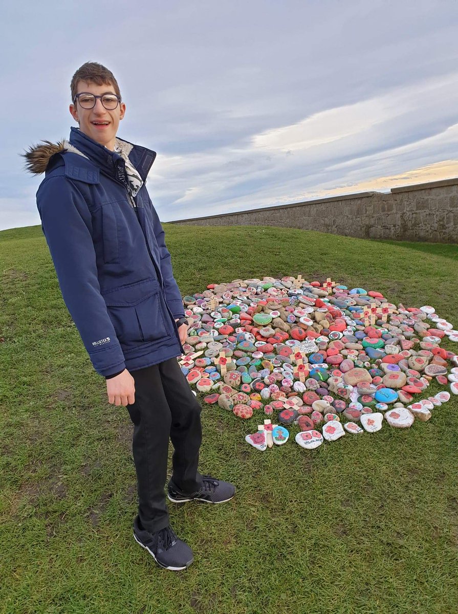 Pupil Jamie adding to the remembrance stones earlier today. We will remember @HTLossieHigh @LossieHigh